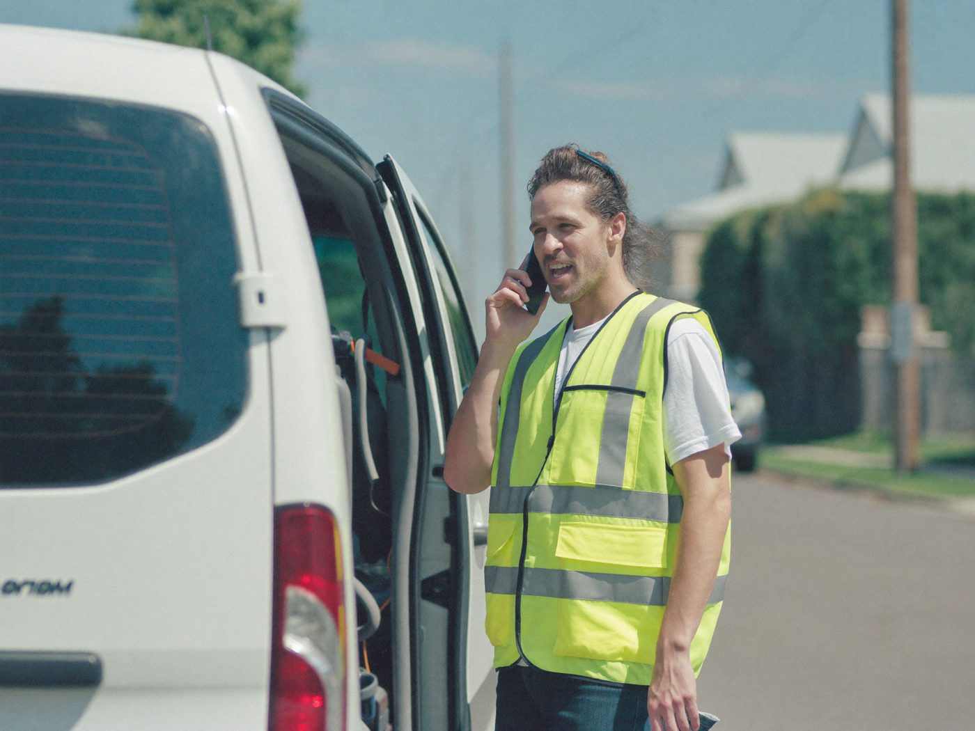 A contractor taking a call while ScaleDesk handles the office